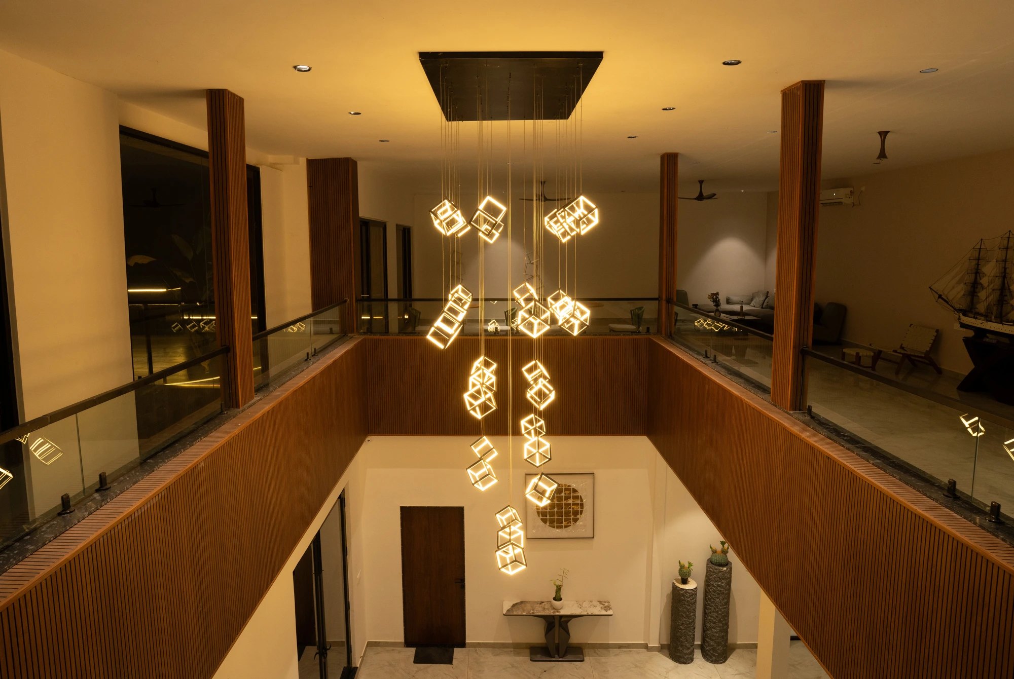 Azure Cove — double-height atrium with cascading light cubes