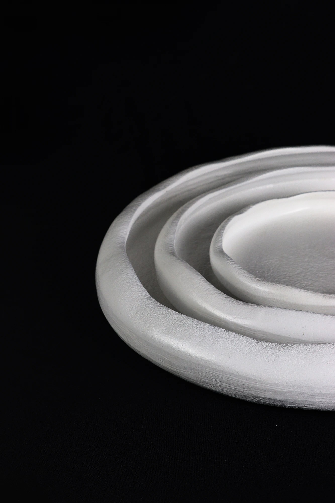 Cle and Co — stacked white ceramic bowls on black
