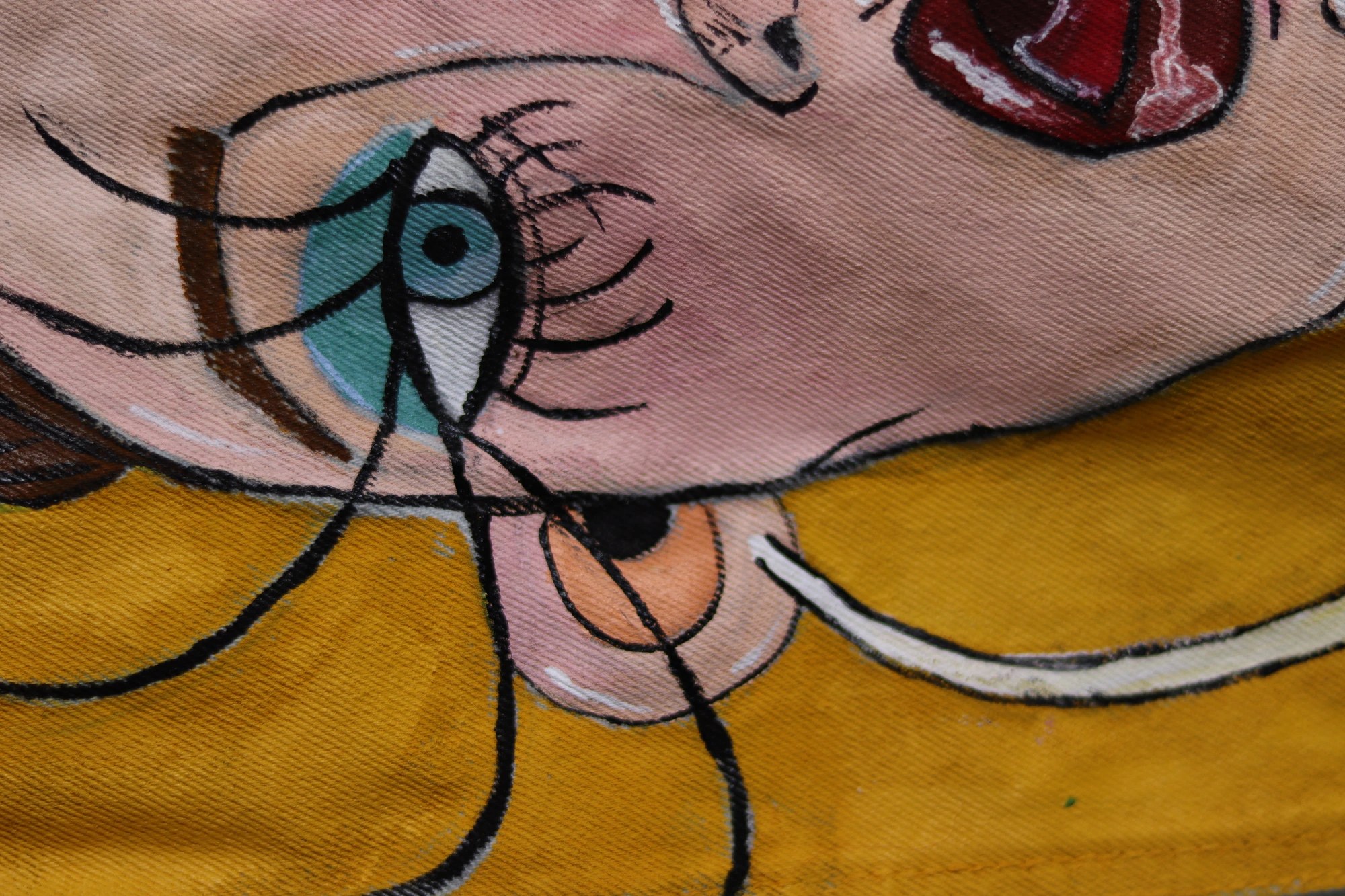 Umca — hand-painted fabric detail in pink and ochre